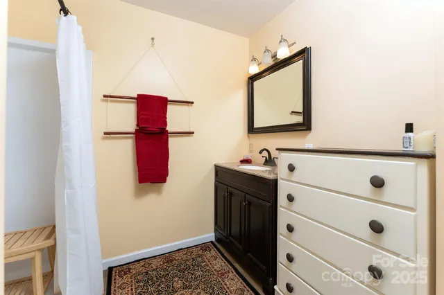 a bathroom with a bathtub and shower