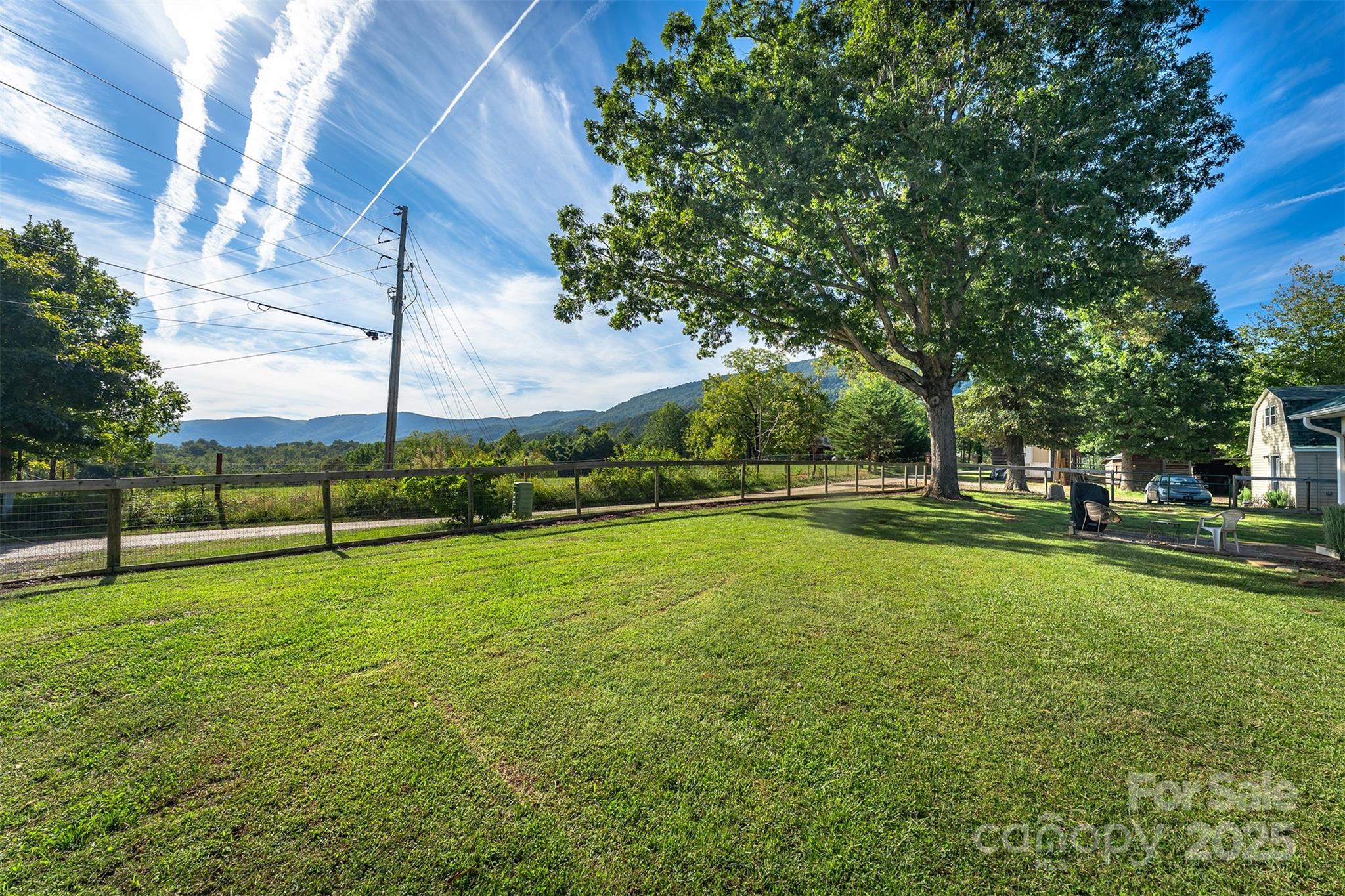 1434 Lake Adger Road Mill Spring, NC 28756 - Photo 26 of 48 a view of a golf course with a park