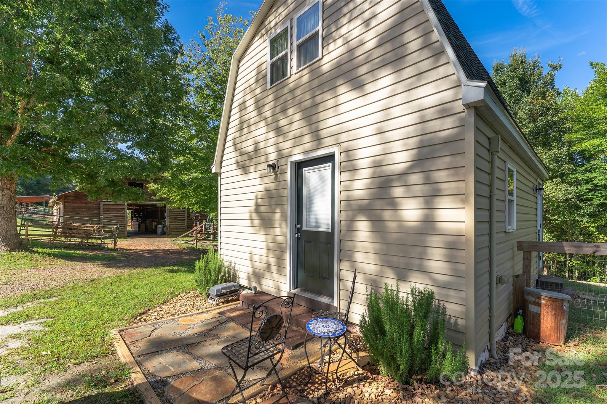 1434 Lake Adger Road Mill Spring, NC 28756 - Photo 27 of 48 a view of backyard with a garden and plants
