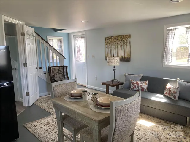 a bedroom with a bed lamp and window