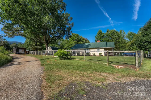 a view of a house with a big yard