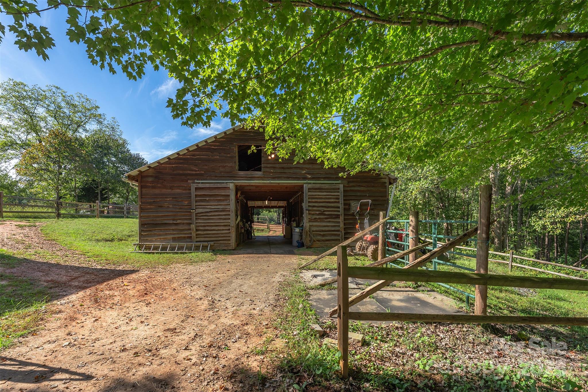 1434 Lake Adger Road Mill Spring, NC 28756 - Photo 33 of 48 a view of a house with backyard