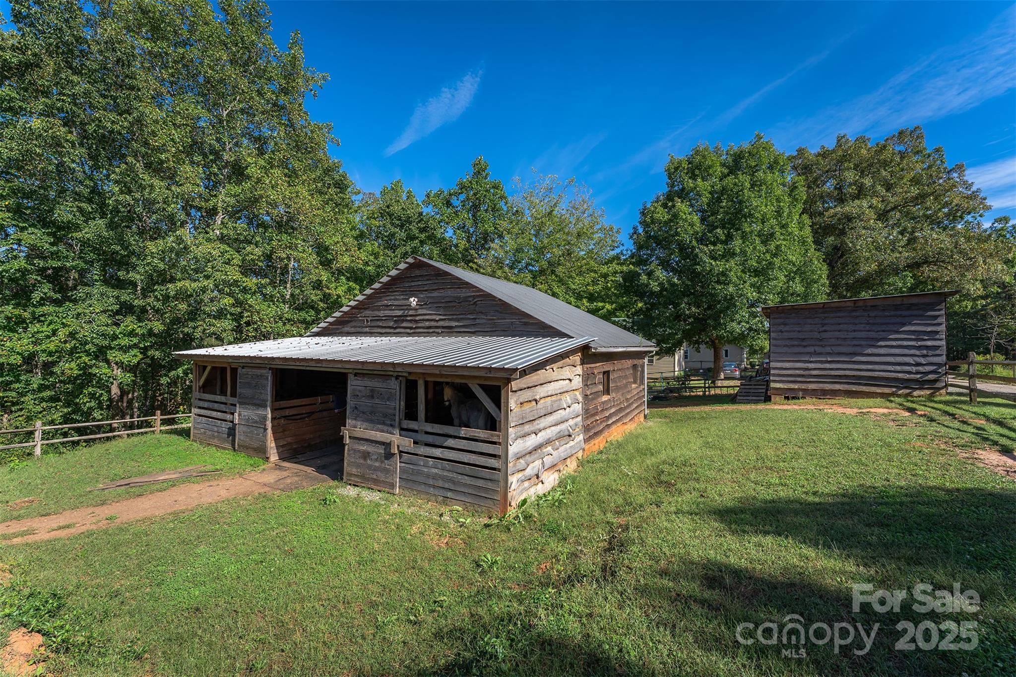 1434 Lake Adger Road Mill Spring, NC 28756 - Photo 38 of 48 a front view of a house with garden