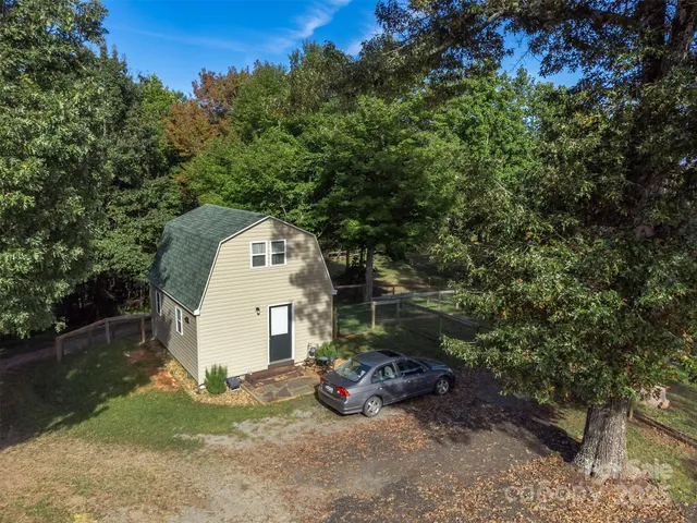 an aerial view of a house with mountain view