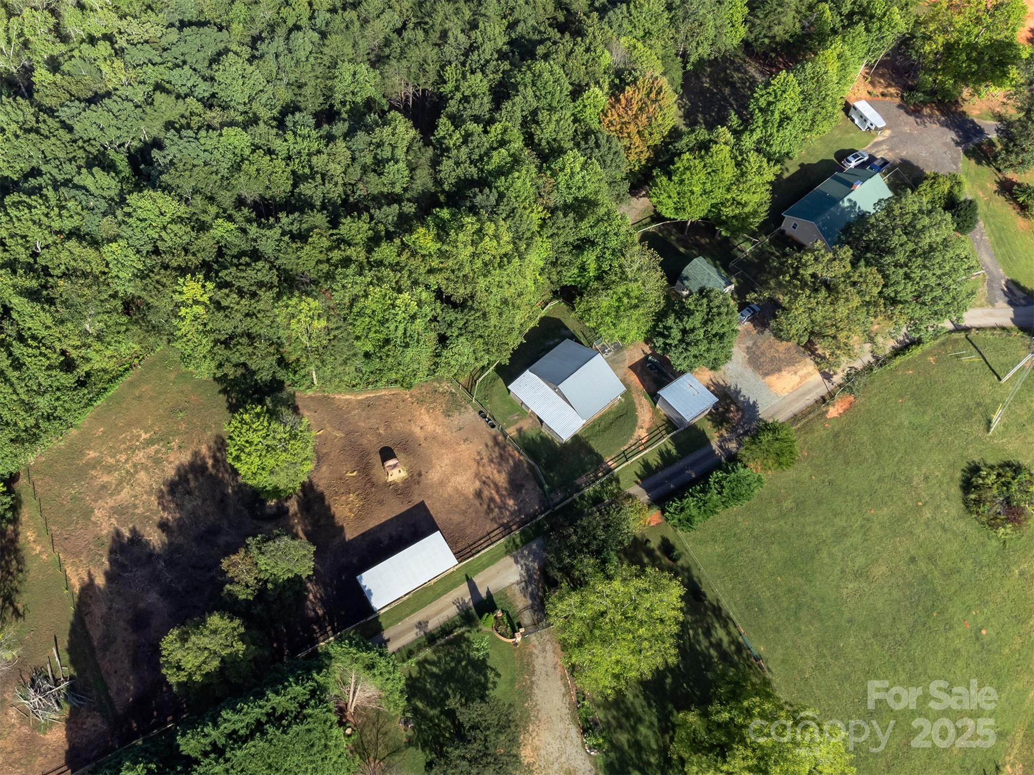 1434 Lake Adger Road Mill Spring, NC 28756 - Photo 46 of 48 an aerial view of a house with a yard