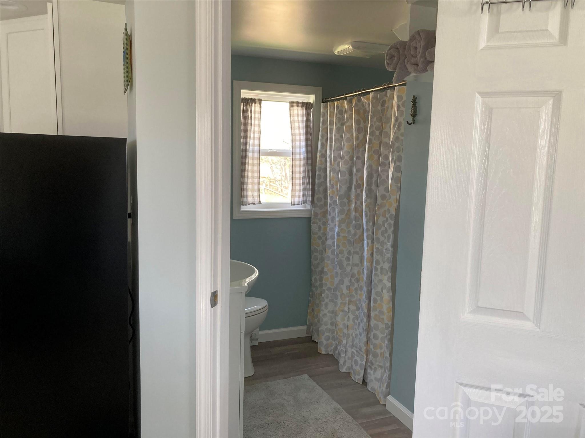 1434 Lake Adger Road Mill Spring, NC 28756 - Photo 48 of 48 a view of a bathroom with a toilet