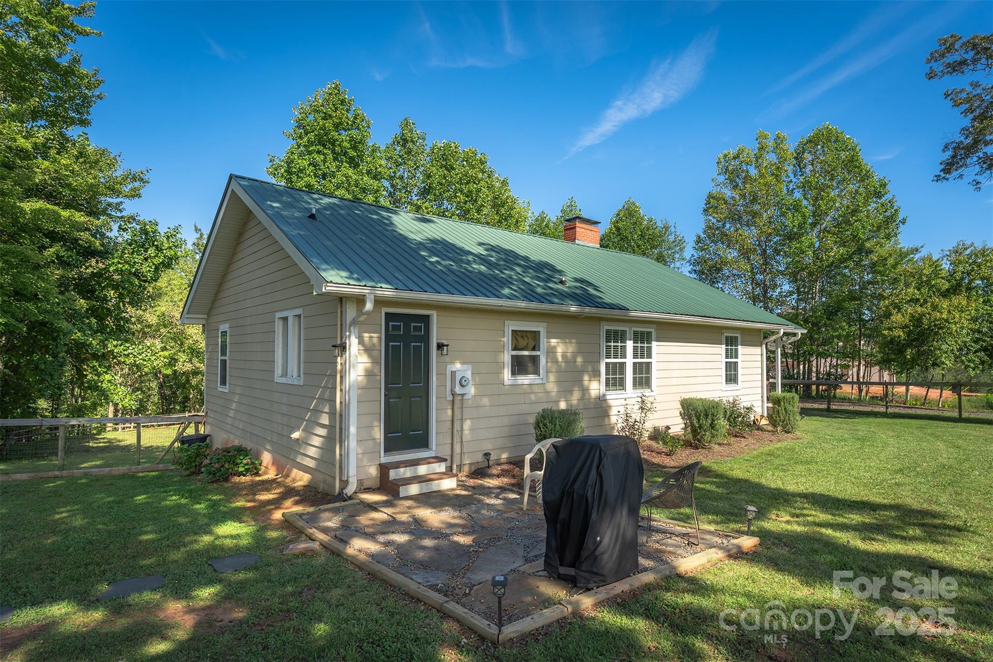 1434 Lake Adger Road Mill Spring, NC 28756 - Photo 5 of 48 a front view of house with yard and green space