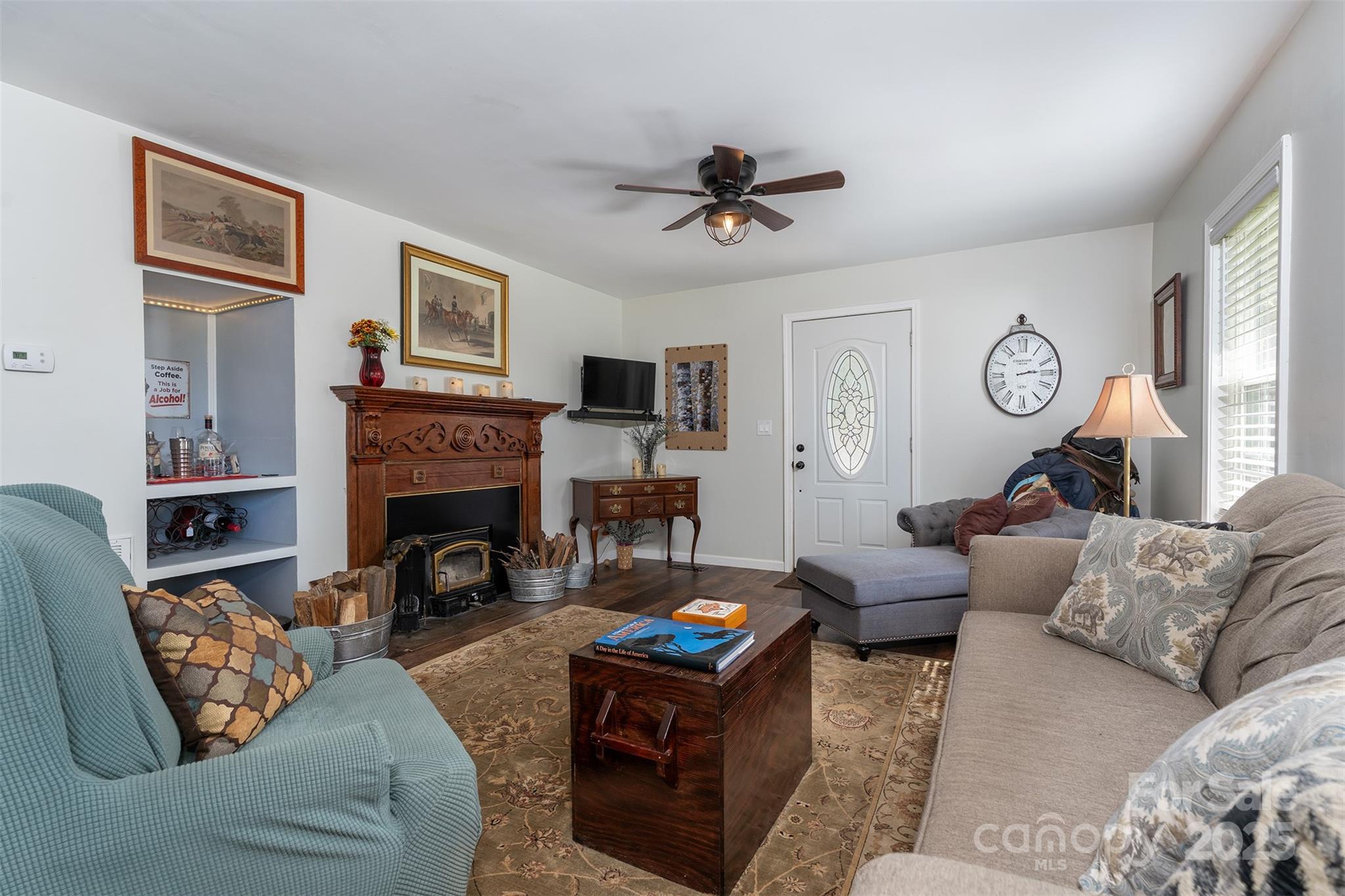 1434 Lake Adger Road Mill Spring, NC 28756 - Photo 7 of 48 a living room with furniture fireplace and window
