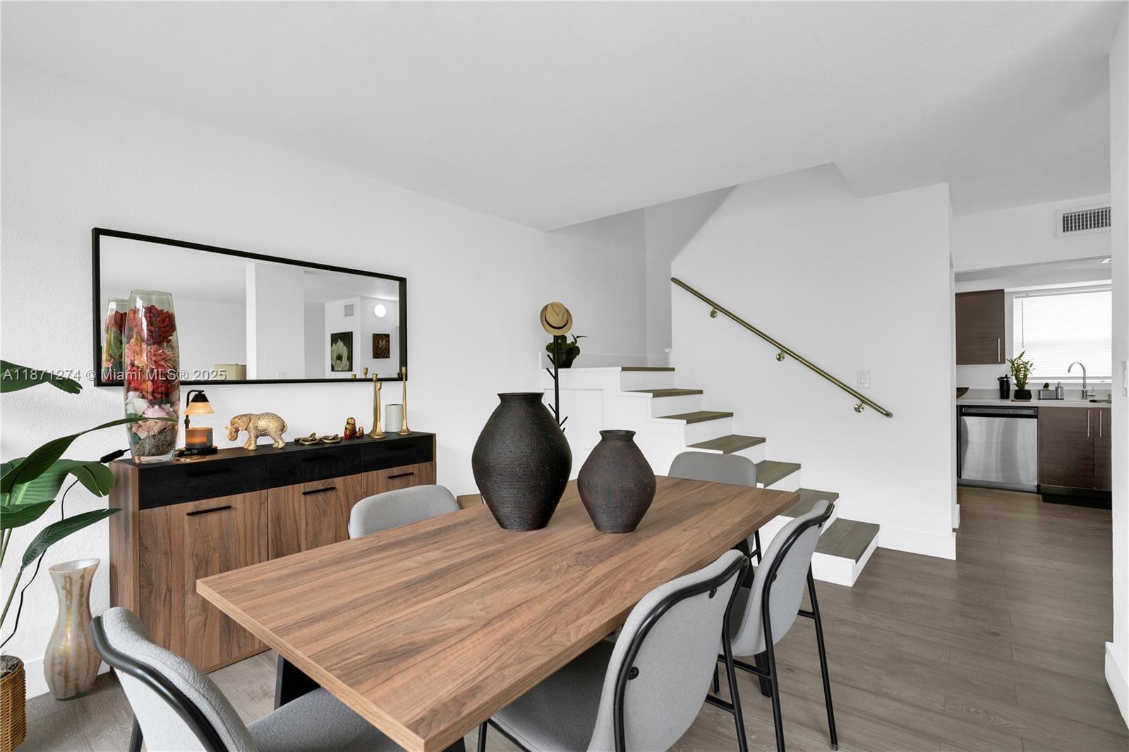 830 Northwest 87th Avenue, Unit 406 Miami, FL 33172 - Photo 11 of 40 a view of a dining room with furniture and wooden floor