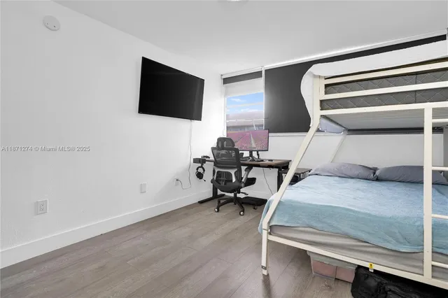 a bathroom with a sink toilet and a mirror