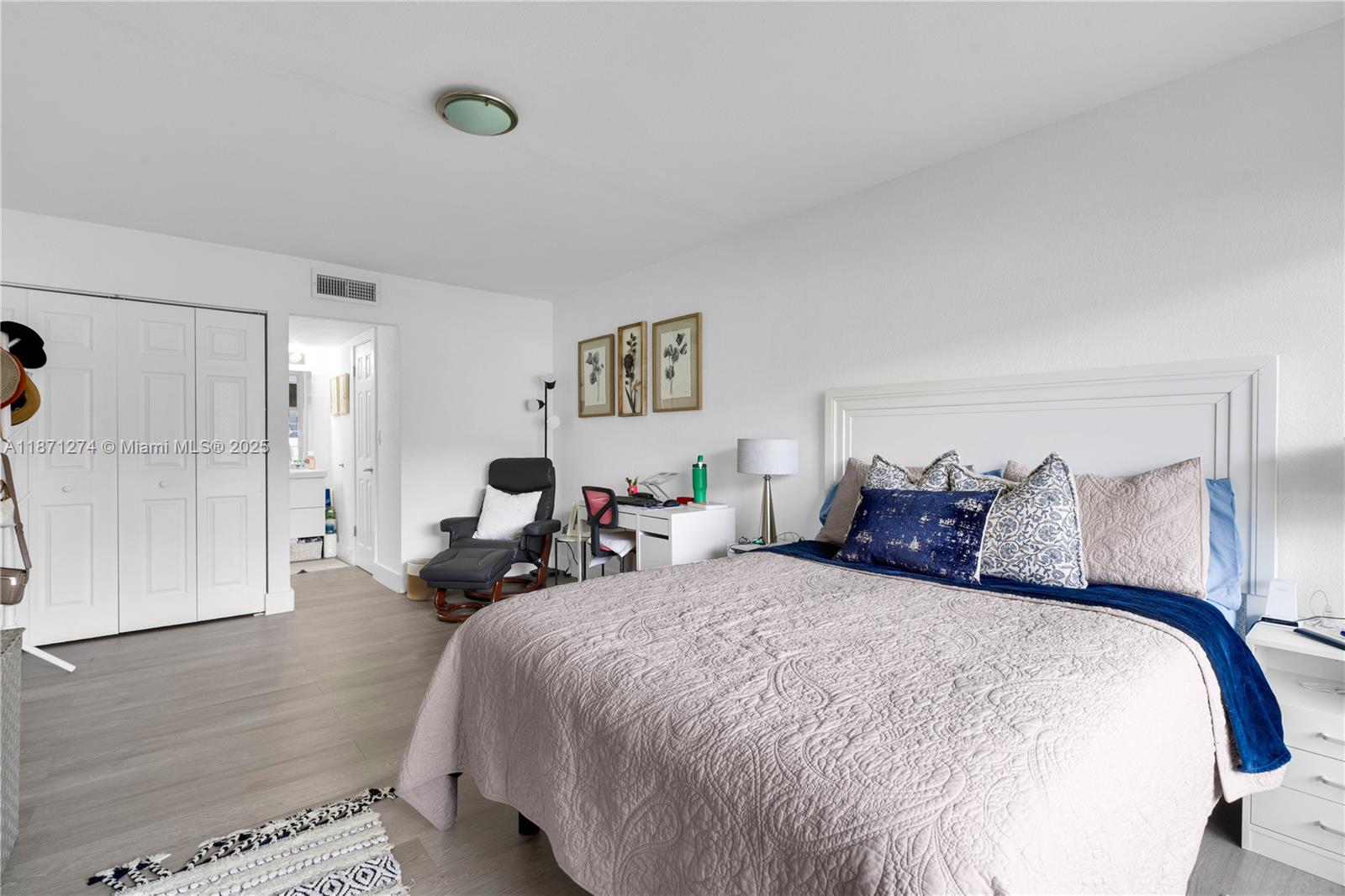 830 Northwest 87th Avenue, Unit 406 Miami, FL 33172 - Photo 26 of 40 a bed room with two beds and a lamp