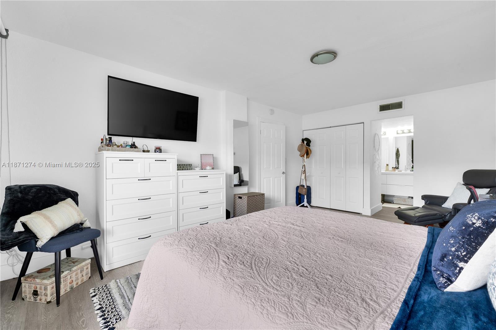 830 Northwest 87th Avenue, Unit 406 Miami, FL 33172 - Photo 27 of 40 a bedroom with a bed and a flat screen tv