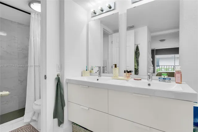 a en suite bathroom with a sink and a mirror