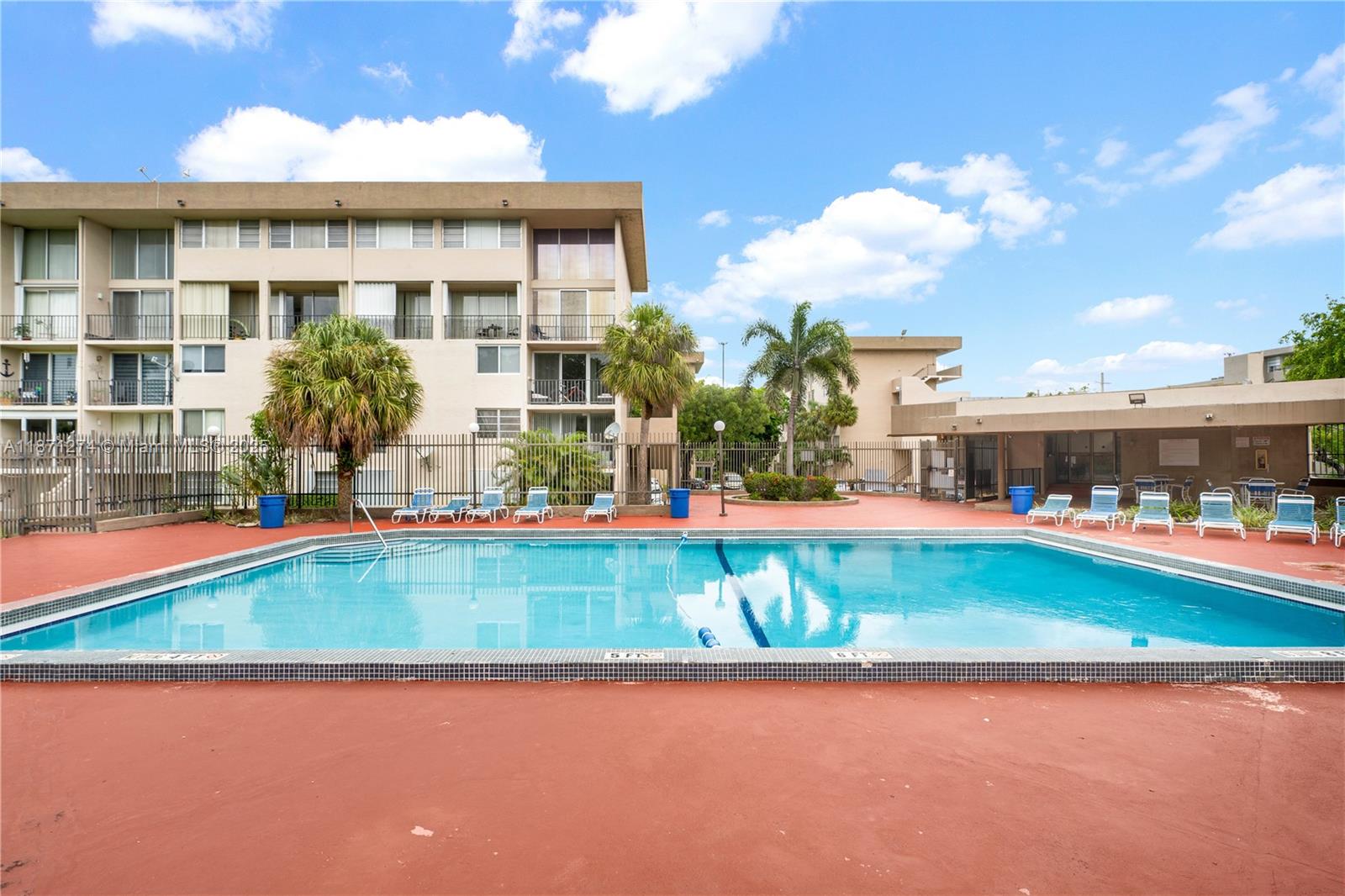 830 Northwest 87th Avenue, Unit 406 Miami, FL 33172 - Photo 36 of 40 a view of swimming pool with outdoor seating
