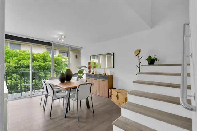 a view of a livingroom with furniture and a window