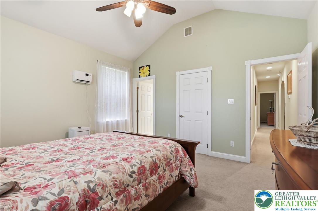 5217 Cider Press Road Schnecksville, PA 18078 - Photo 35 of 54 a bedroom with a bed and a chandelier