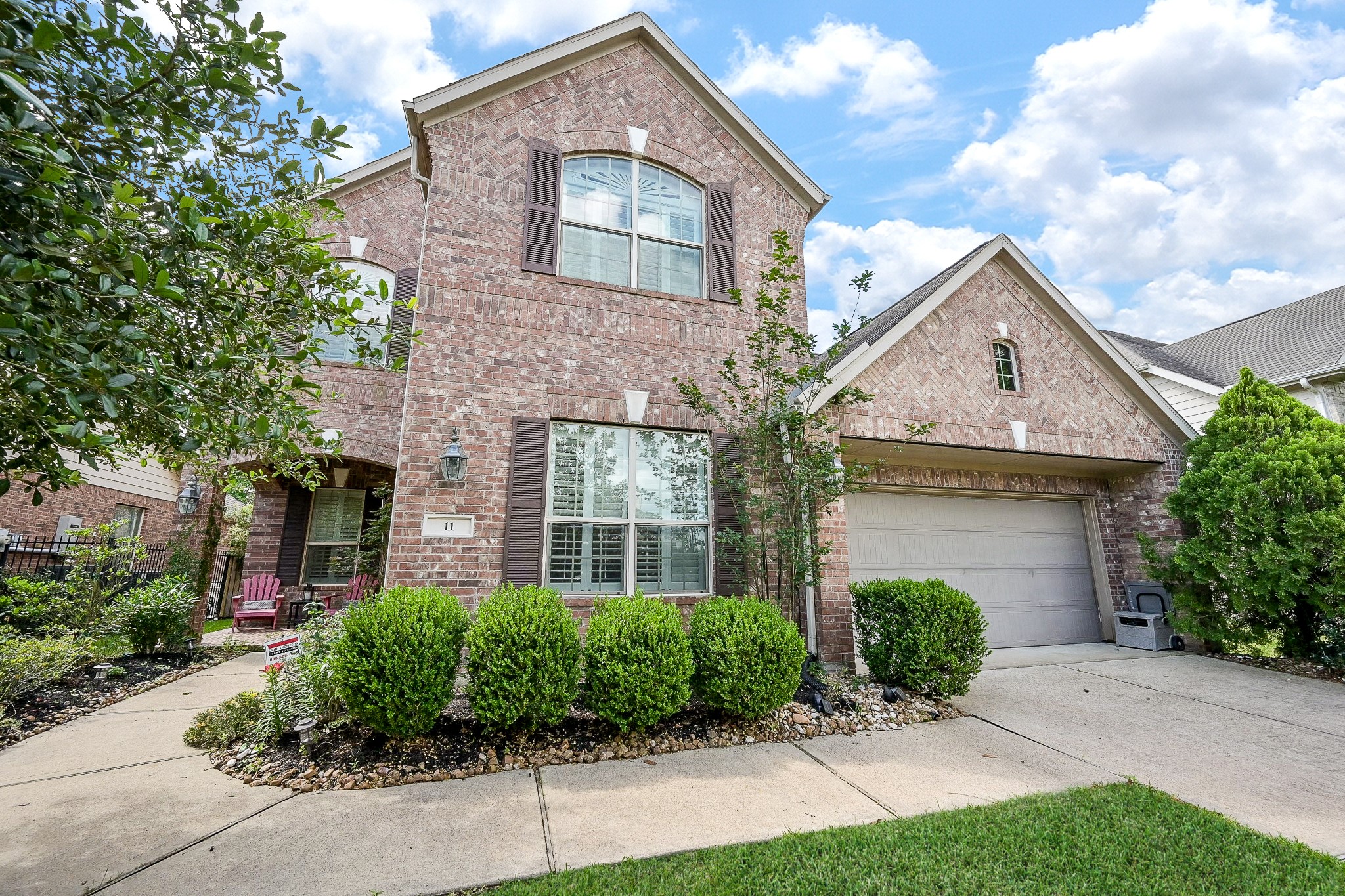 11 South Victoriana Circle Spring, TX 77389 - Photo 1 of 38 a front view of a house with a yard