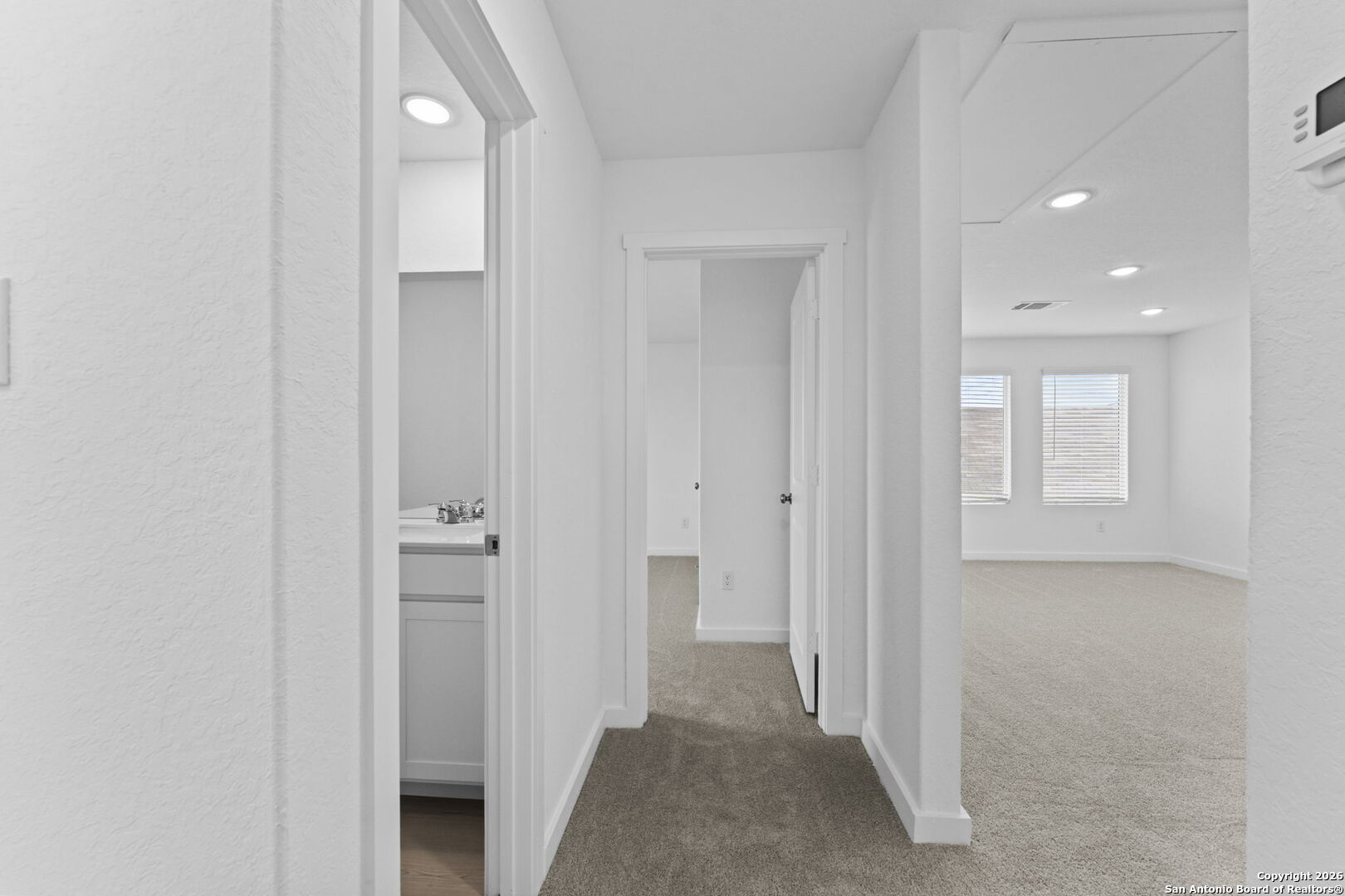 1875 Nuthatch Ridge New Braunfels, TX 78130 - Photo 29 of 34 a view of a hallway with closet and bathroom