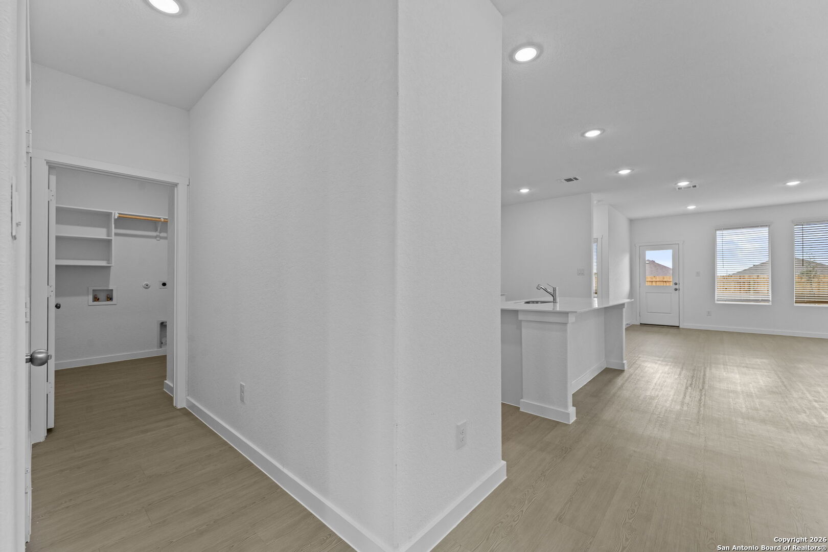 1875 Nuthatch Ridge New Braunfels, TX 78130 - Photo 9 of 34 a view of a hallway with a kitchen