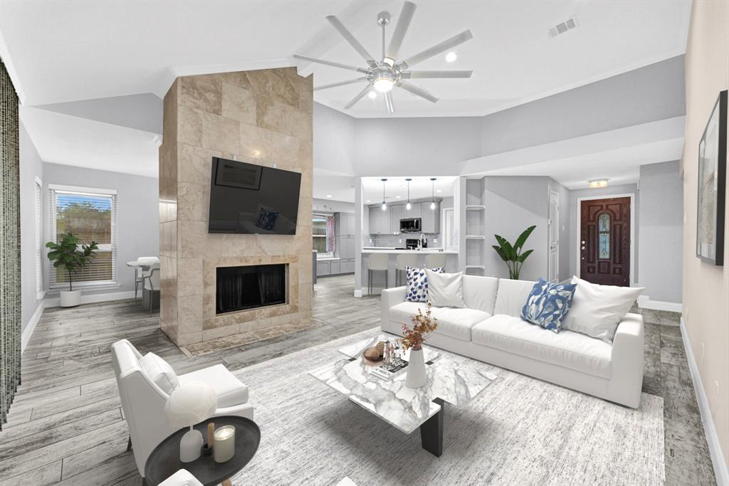 10510 Kirkgreen Drive Houston, TX 77089 - Photo 1 of 27 a living room with furniture a fireplace and a flat screen tv