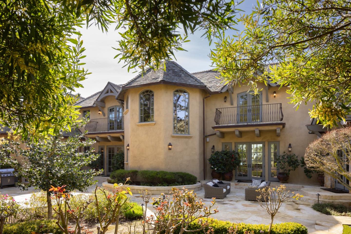 3957 Ronda Road Pebble Beach, CA 93953 - Photo 13 of 26 a front view of a house with garden