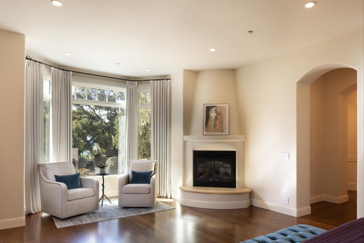 3957 Ronda Road Pebble Beach, CA 93953 - Photo 16 of 26 a living room with furniture and a fireplace