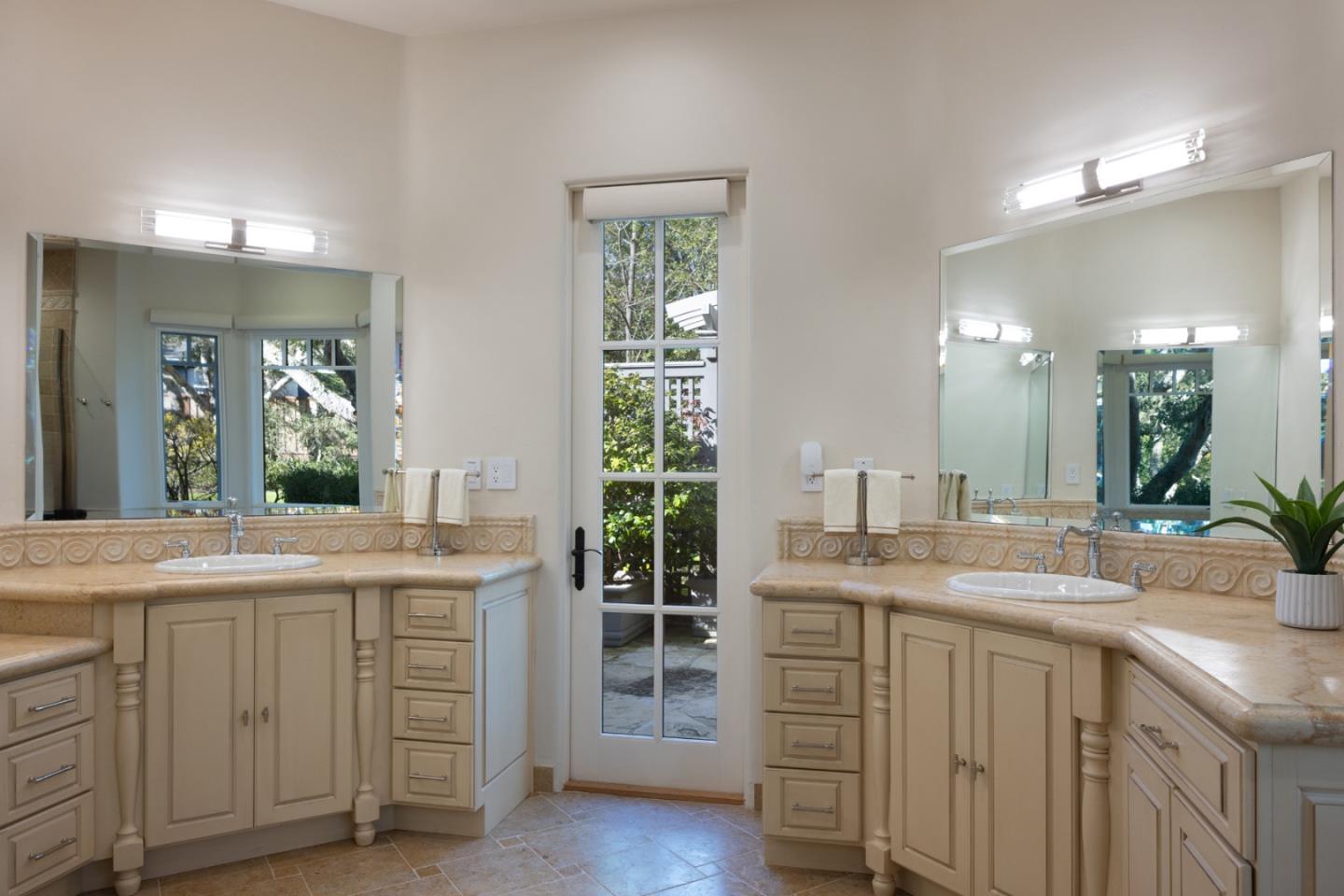 3957 Ronda Road Pebble Beach, CA 93953 - Photo 17 of 26 a bathroom with a sink and a mirror