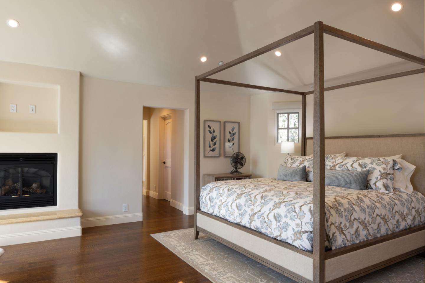 3957 Ronda Road Pebble Beach, CA 93953 - Photo 19 of 26 a bedroom with a bed and a fireplace
