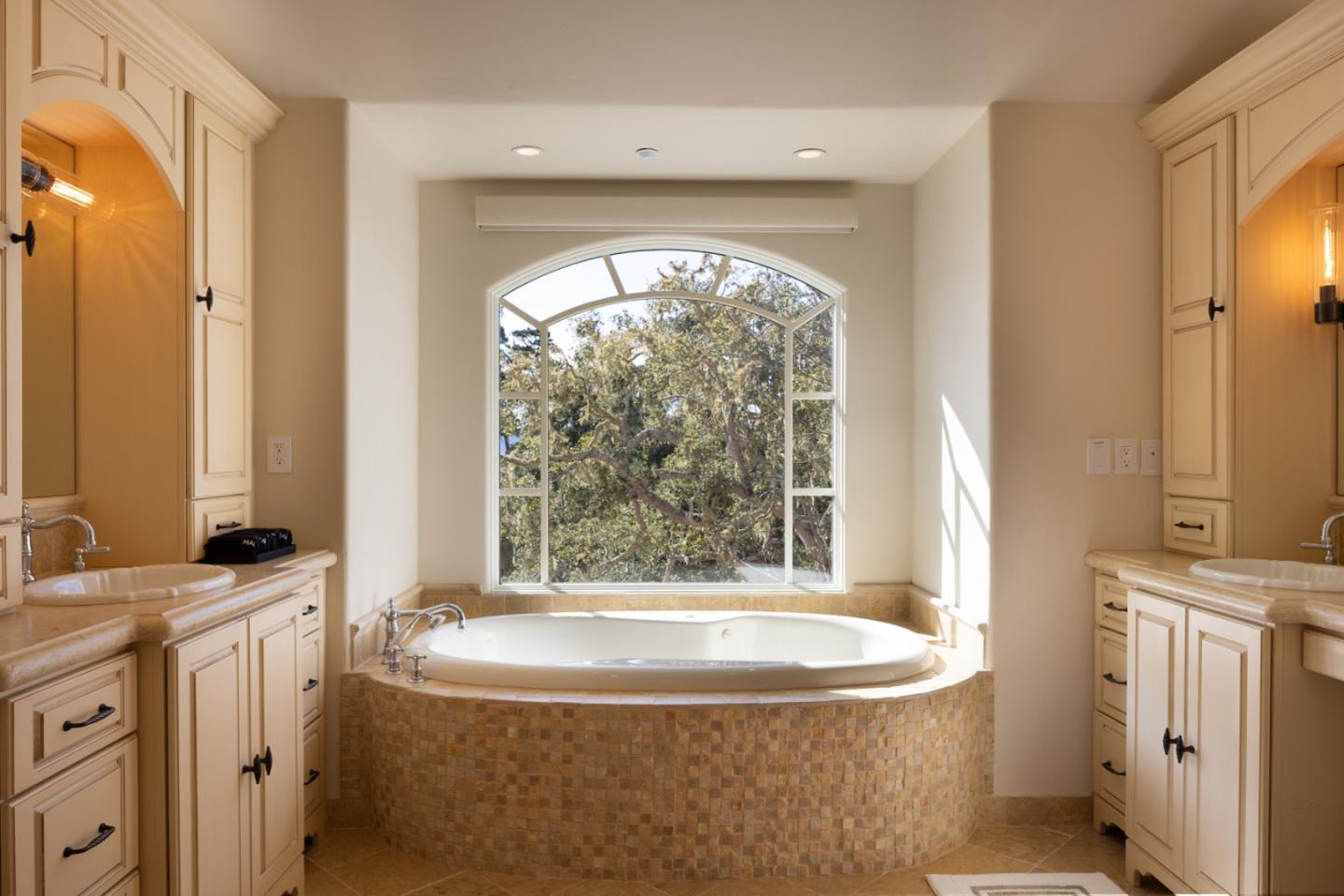 3957 Ronda Road Pebble Beach, CA 93953 - Photo 21 of 26 a view of bathroom with bathtub and window