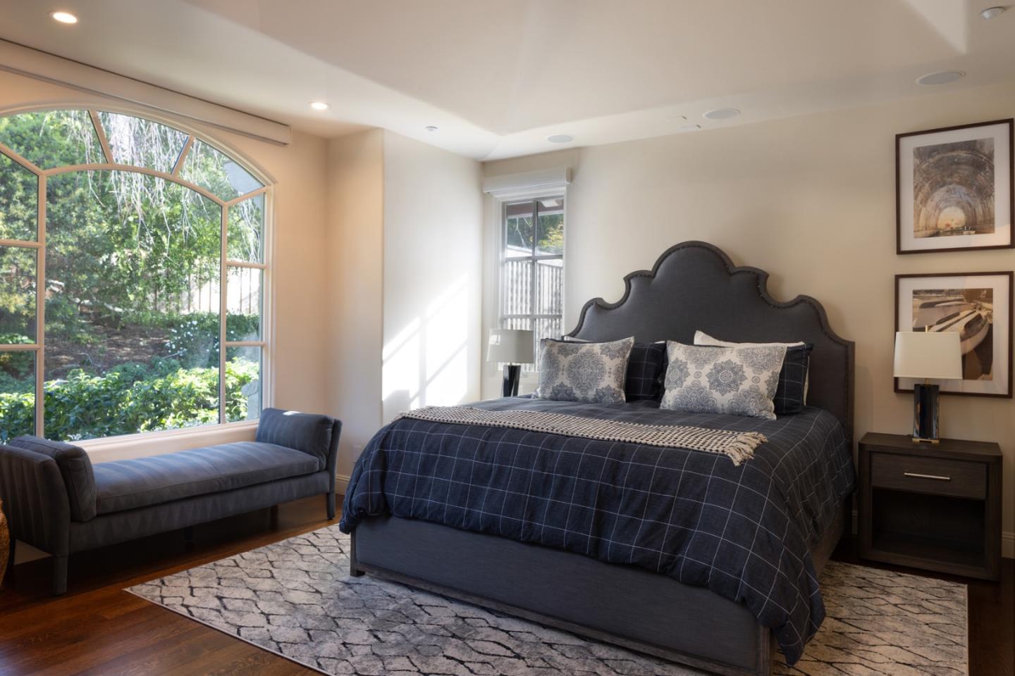 3957 Ronda Road Pebble Beach, CA 93953 - Photo 23 of 26 a bedroom with a bed and wooden floor