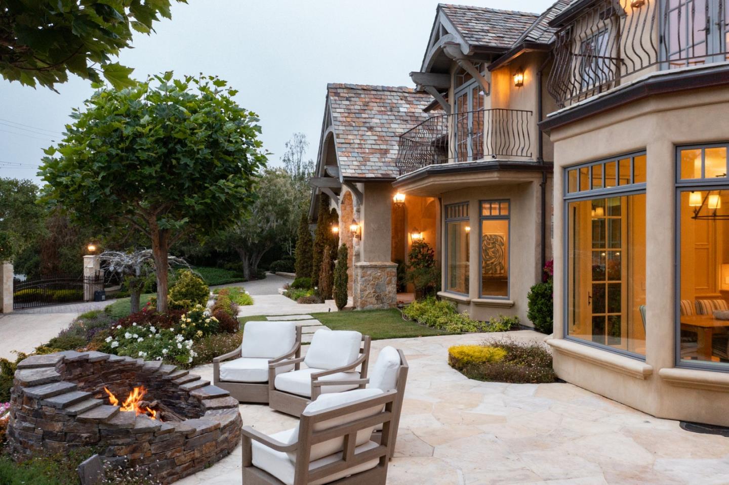 3957 Ronda Road Pebble Beach, CA 93953 - Photo 25 of 26 a view of a patio with couches table and chairs and potted plants