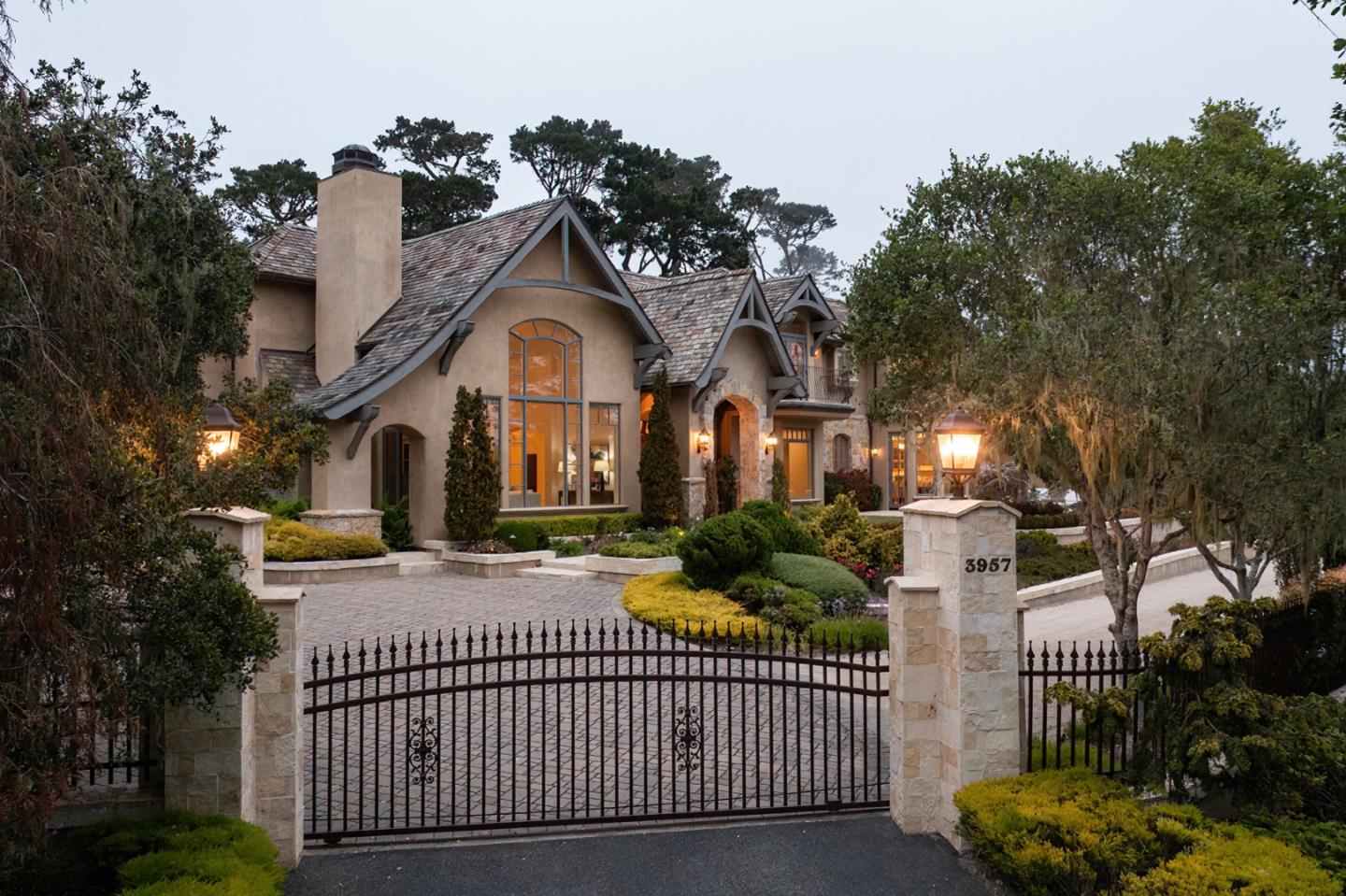 3957 Ronda Road Pebble Beach, CA 93953 - Photo 26 of 26 a front view of a house with a iron fence