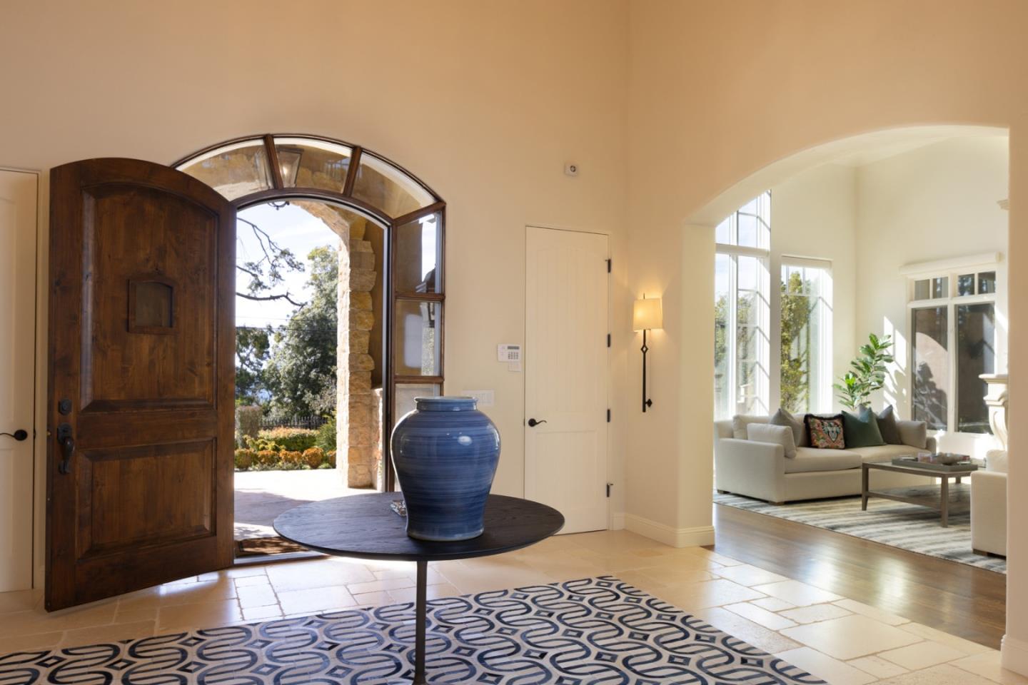3957 Ronda Road Pebble Beach, CA 93953 - Photo 4 of 26 a living room with furniture and a potted plant