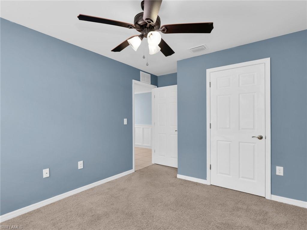 731 Hadley Place West Naples, FL 34104 - Photo 7 of 30 Bedroom 3 With Ceiling Fan And Closet
