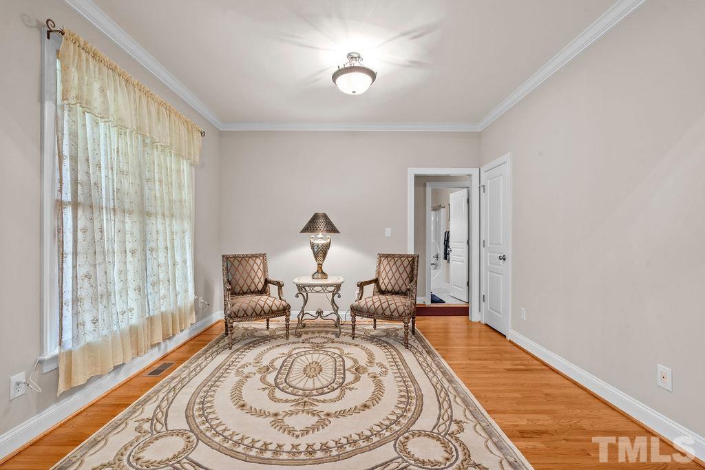 5725 Turner Store Lane Raleigh, NC 27603 - Photo 7 of 30 a living room with furniture and a wooden floor