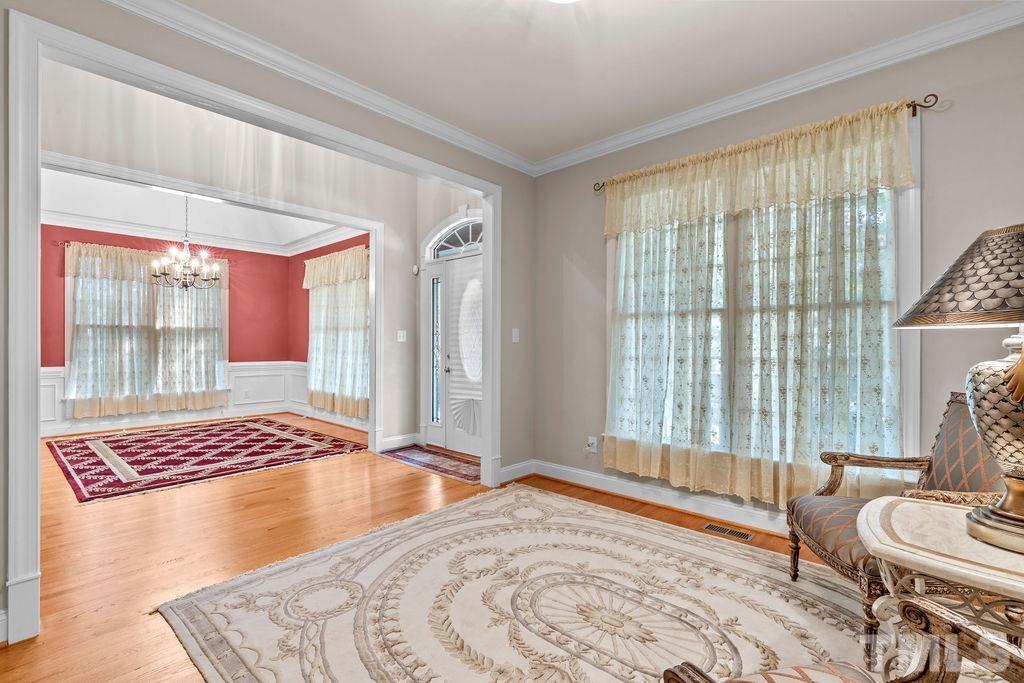 5725 Turner Store Lane Raleigh, NC 27603 - Photo 8 of 30 a bedroom with a bed and wooden floor