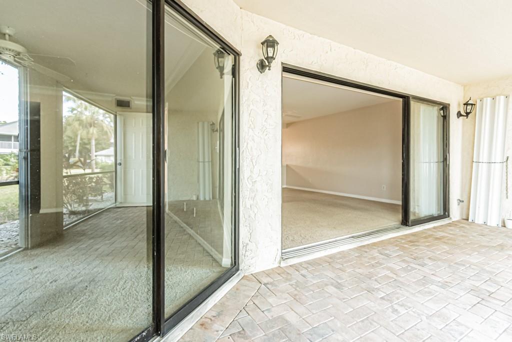 600 Misty Pines Circle, Unit F105 Naples, FL 34105 - Photo 37 of 49 Access from Primary Bedroom and Living Room
