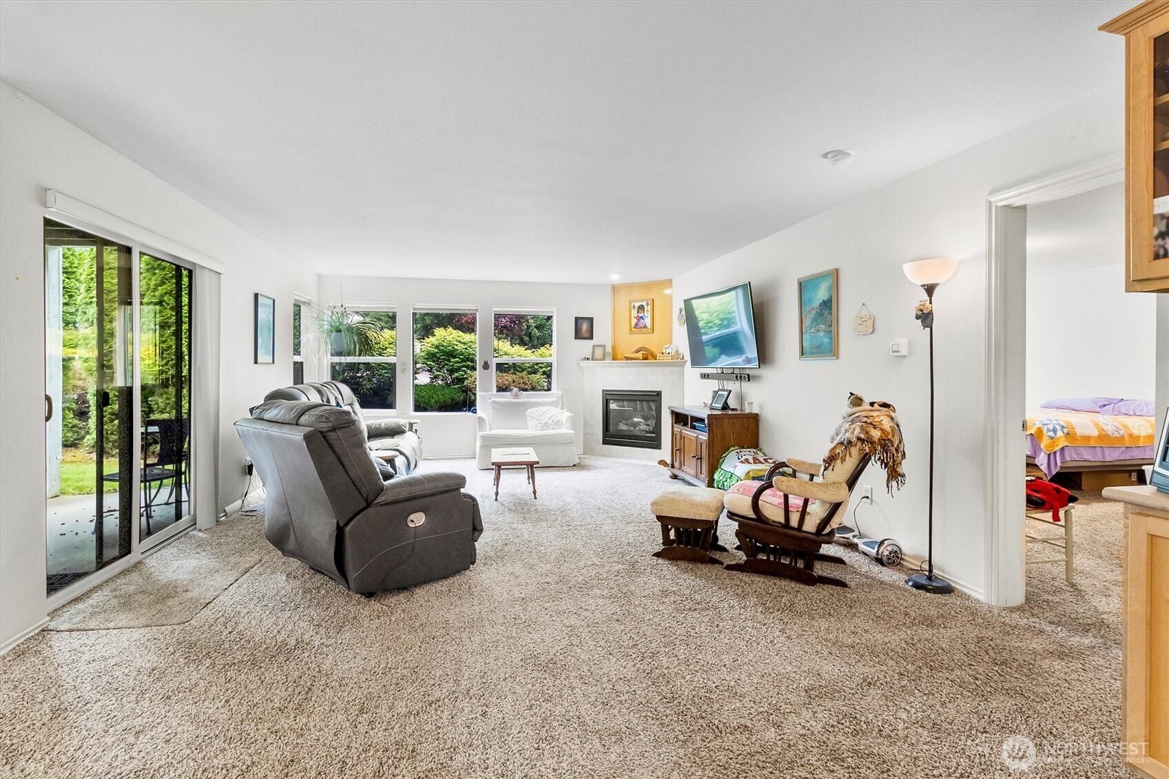344 East Bellis Fair Parkway Bellingham, WA 98226 - Photo 4 of 40 a living room with furniture a large window and a flat screen tv
