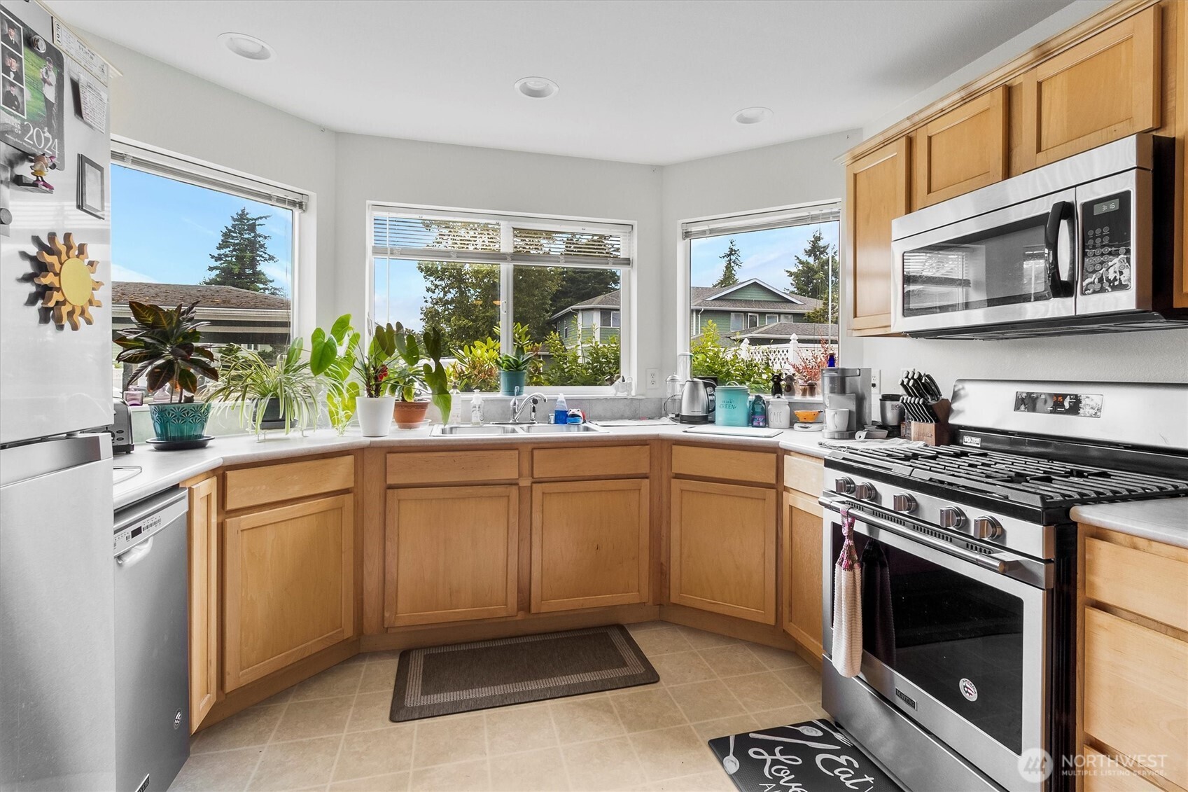 344 East Bellis Fair Parkway Bellingham, WA 98226 - Photo 10 of 40 a kitchen with stainless steel appliances a stove a sink and a microwave
