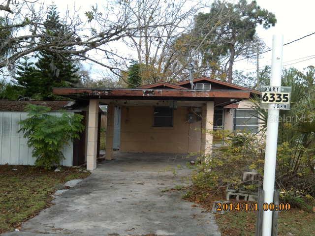 6335 Alaska Avenue New Port Richey, FL 34653 - Photo 1 of 1 a front view of a house with garden