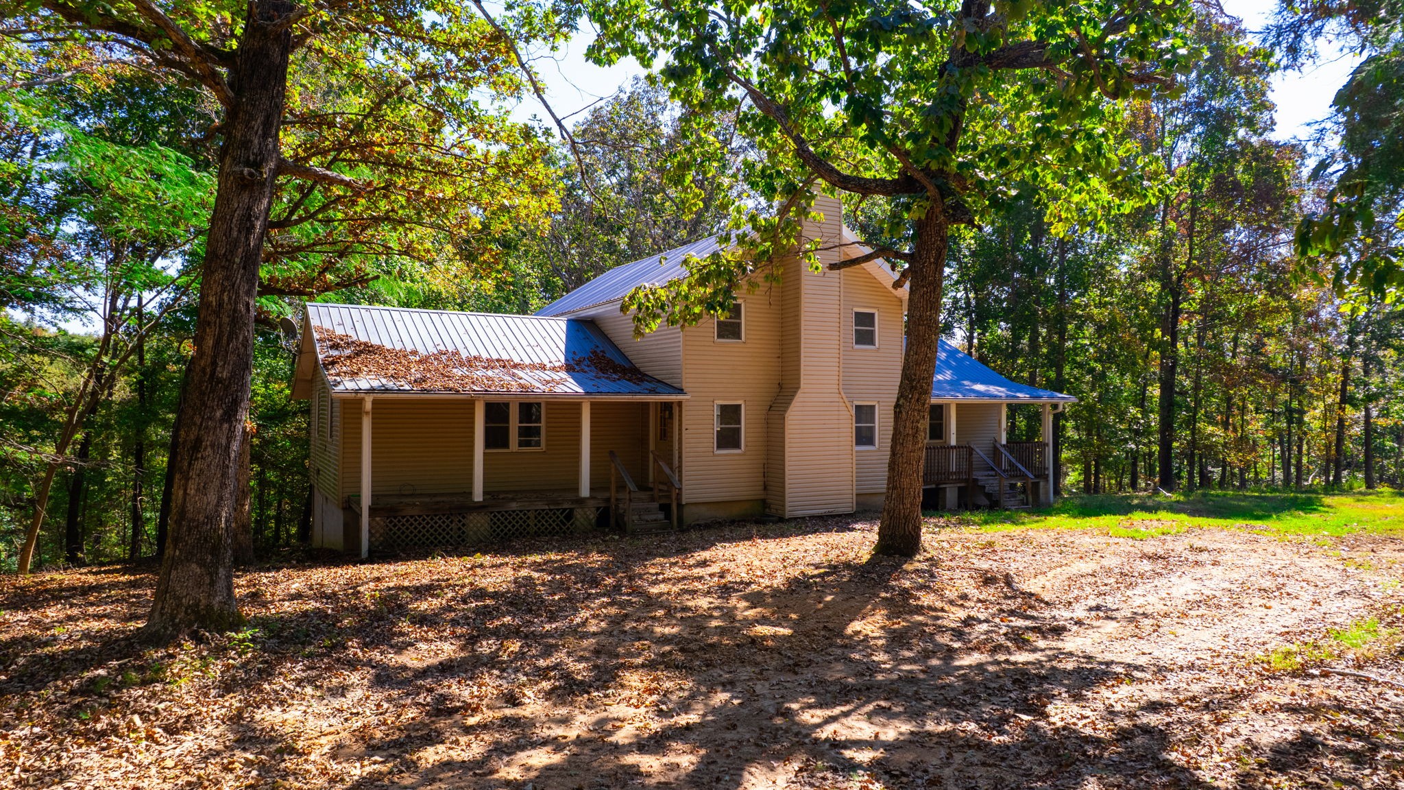 234 Bazzie Dock Road Dover, TN 37058 - Photo 1 of 47 a house with trees in front of it