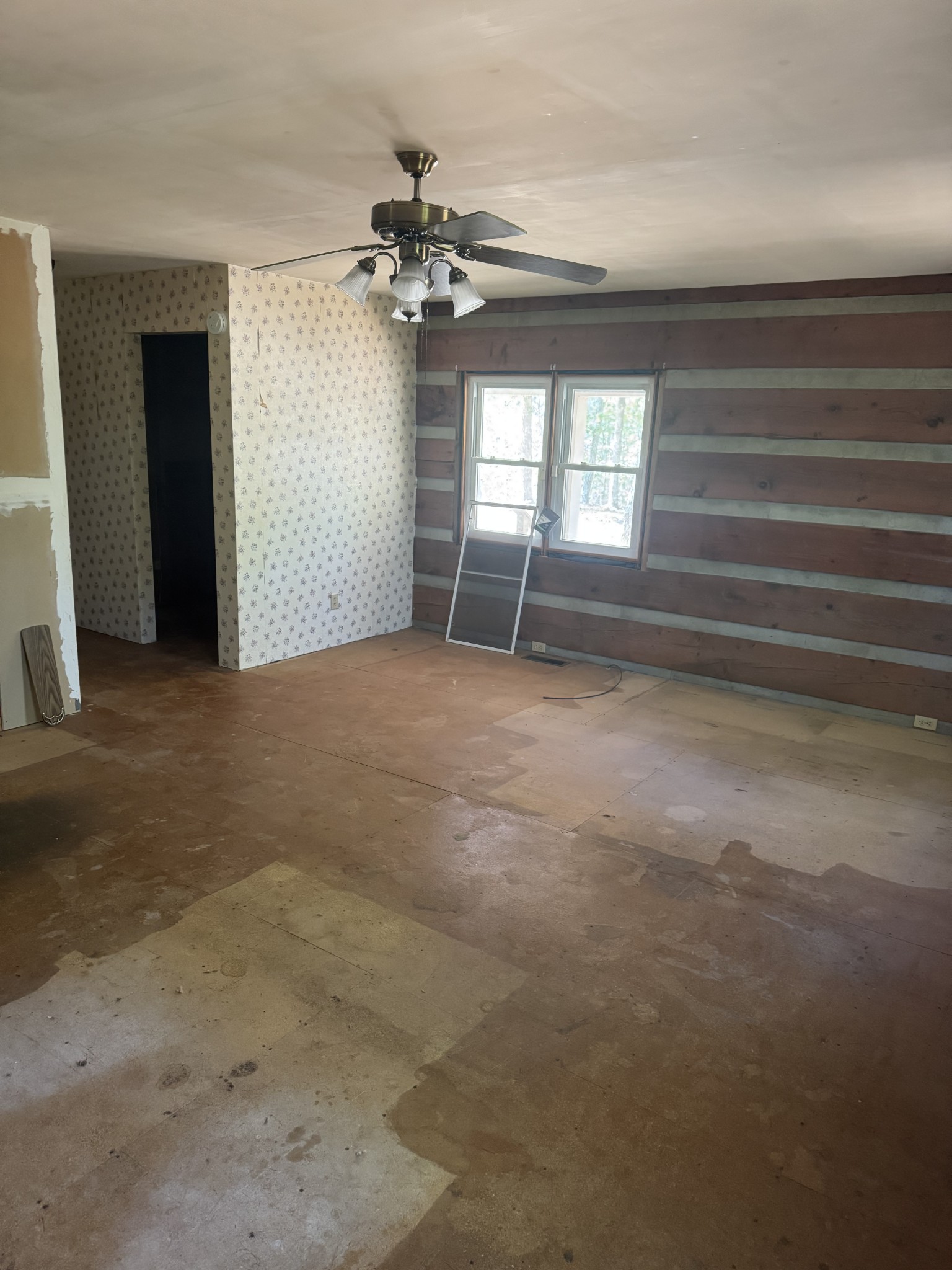 234 Bazzie Dock Road Dover, TN 37058 - Photo 33 of 47 a view of an empty room with a chandelier fan