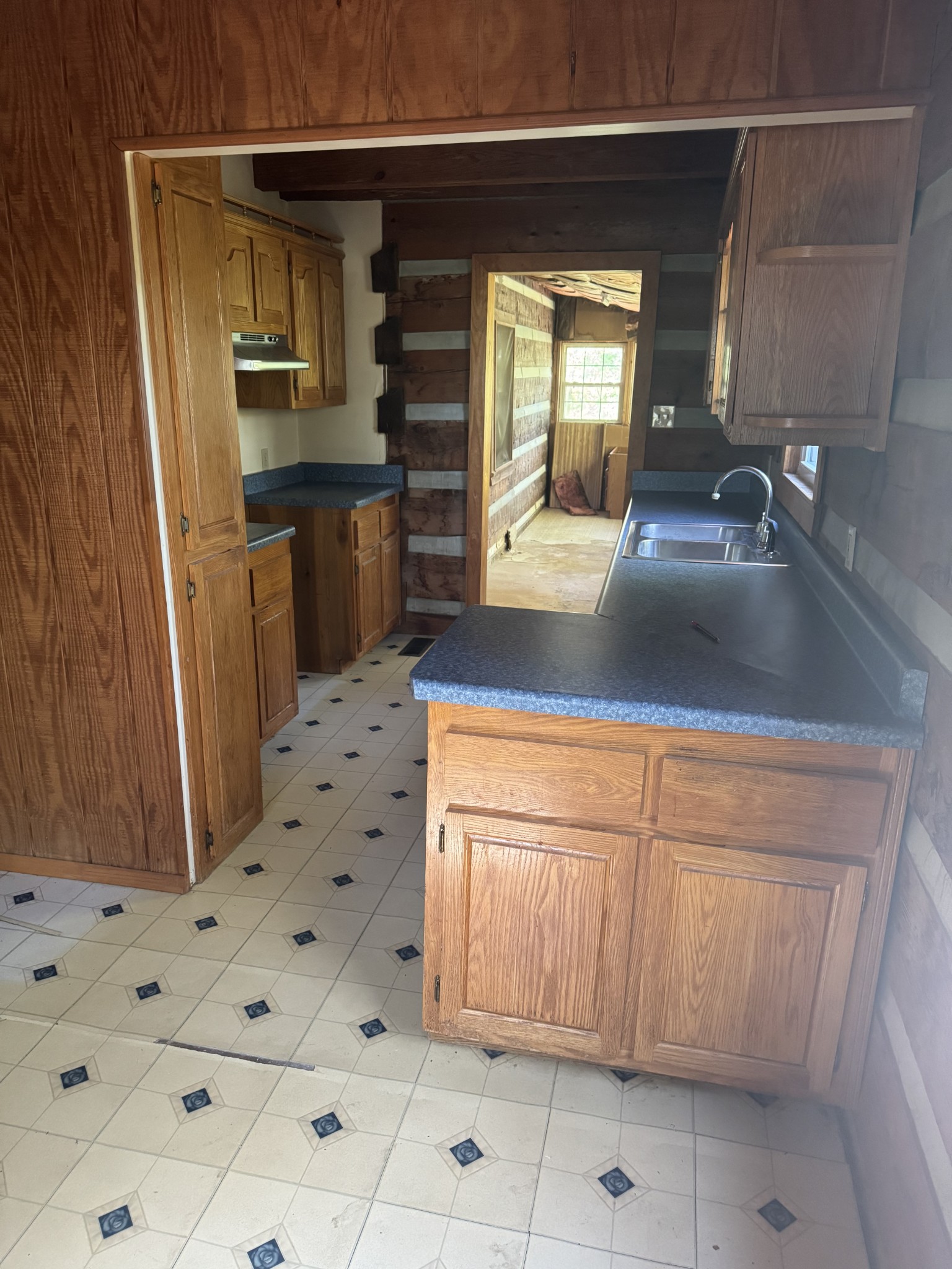 234 Bazzie Dock Road Dover, TN 37058 - Photo 37 of 47 a kitchen with granite countertop a sink and cabinets