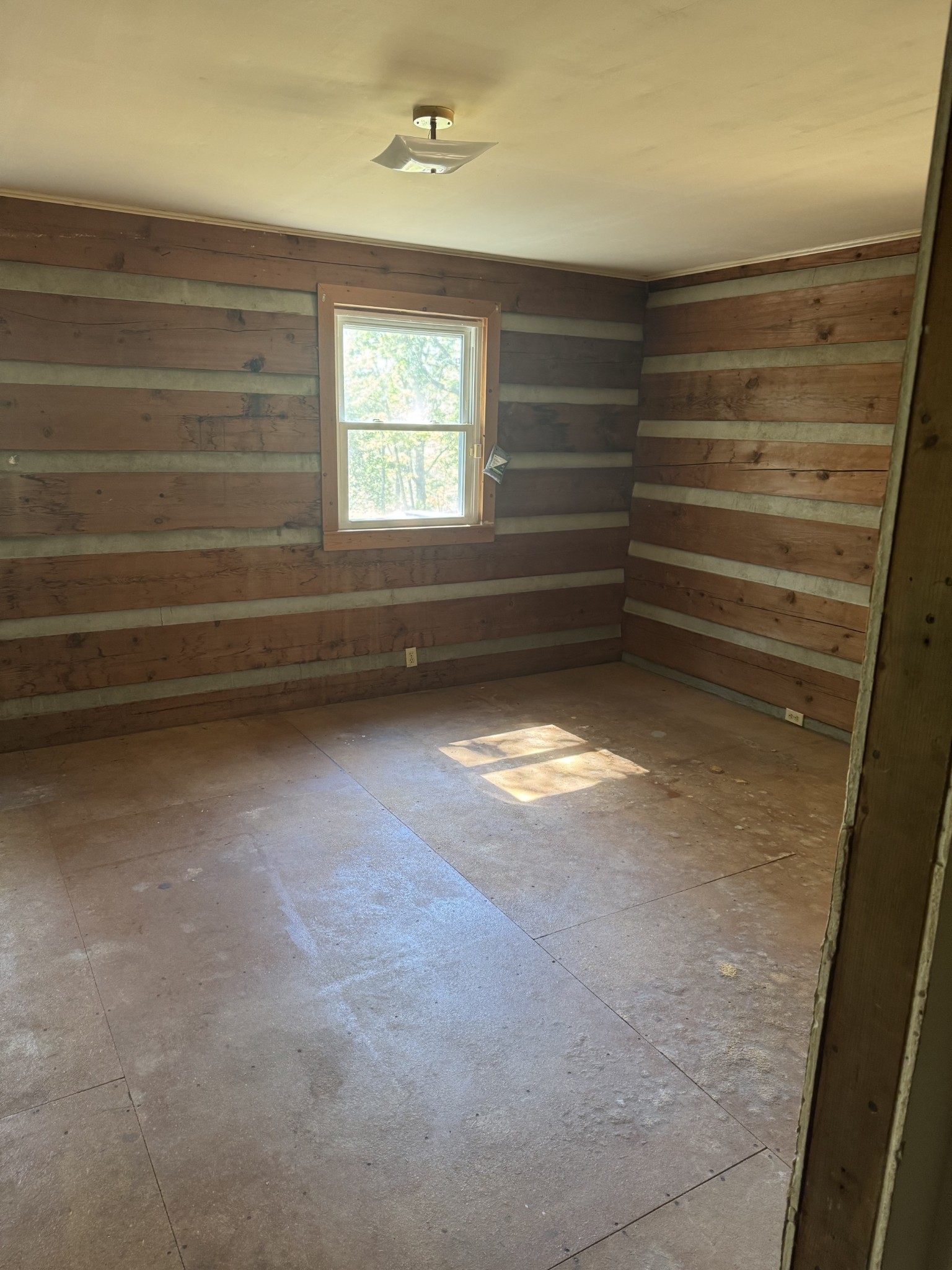 234 Bazzie Dock Road Dover, TN 37058 - Photo 39 of 47 a view of room with window and hardwood floor