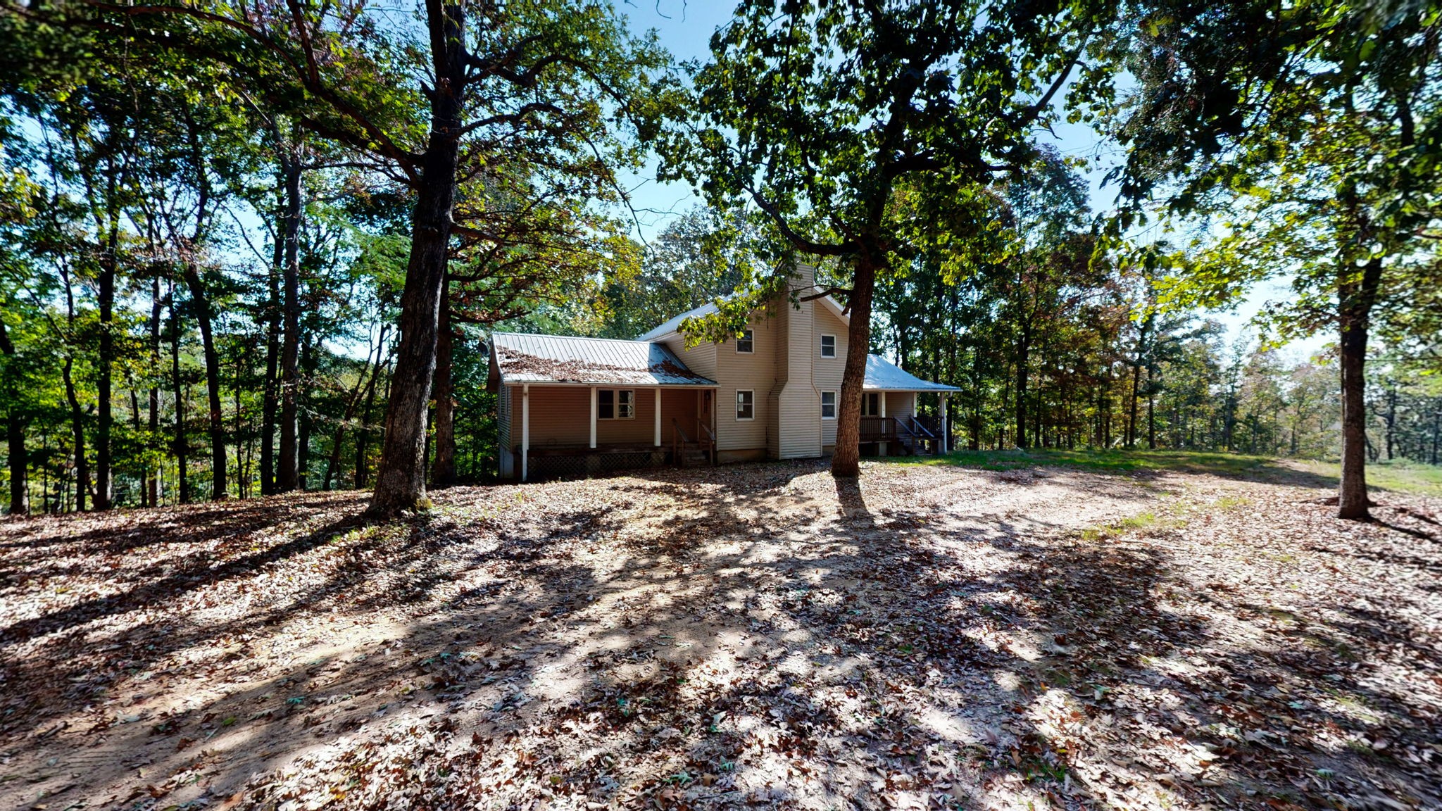 234 Bazzie Dock Road Dover, TN 37058 - Photo 4 of 47 a large tree in front of a house