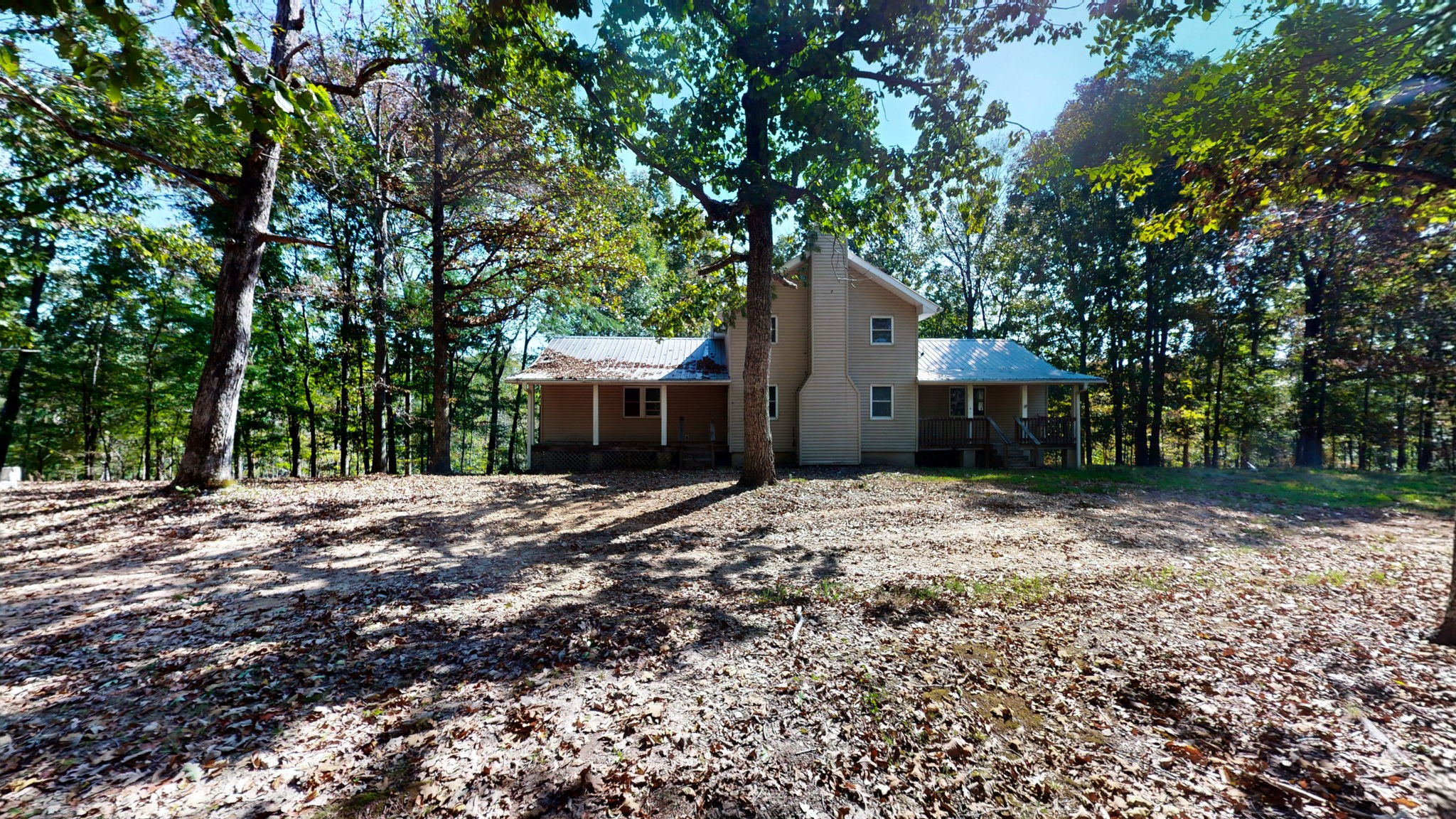 234 Bazzie Dock Road Dover, TN 37058 - Photo 5 of 47 a front view of a house with a garden