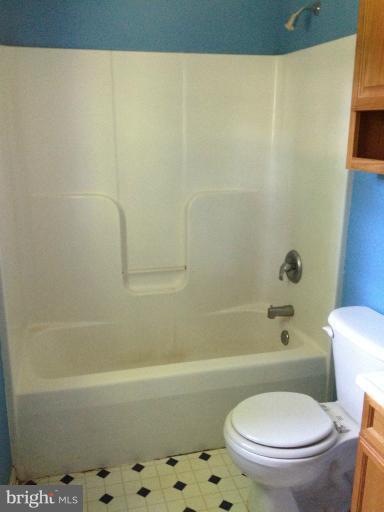 419 Burns Street Ranson, WV 25438 - Photo 20 of 22 a white toilet sitting next to a bath tub