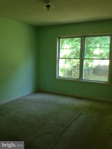 419 Burns Street Ranson, WV 25438 - Photo 8 of 22 a view of an empty room with a window