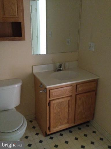 419 Burns Street Ranson, WV 25438 - Photo 9 of 22 a bathroom with a sink toilet and mirror