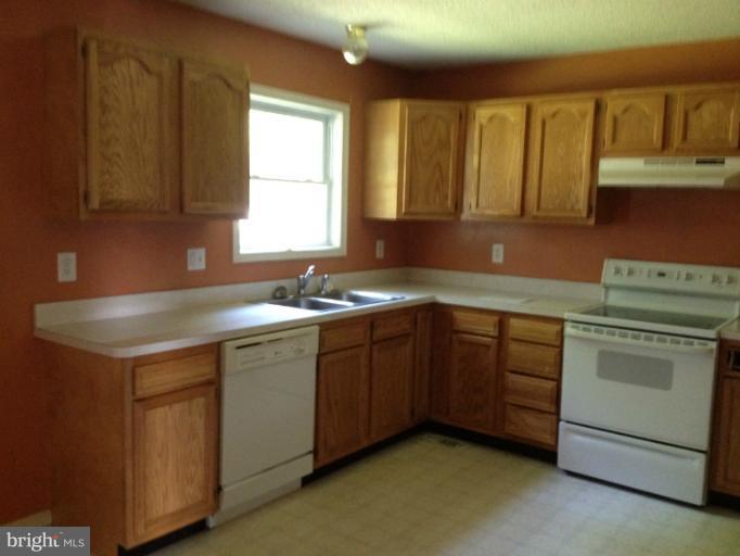 419 Burns Street Ranson, WV 25438 - Photo 10 of 22 a kitchen with a sink cabinets and window